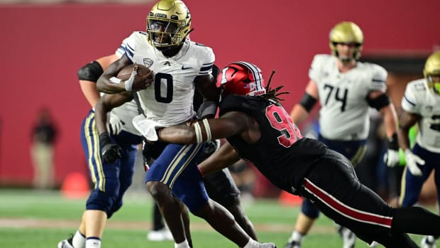 Philip Blidi tackles an Akron ball carrier for Indiana.